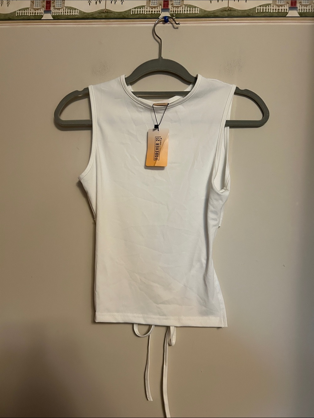 Forever 21 sleeveless top half length back tie across back size 2  new with tag